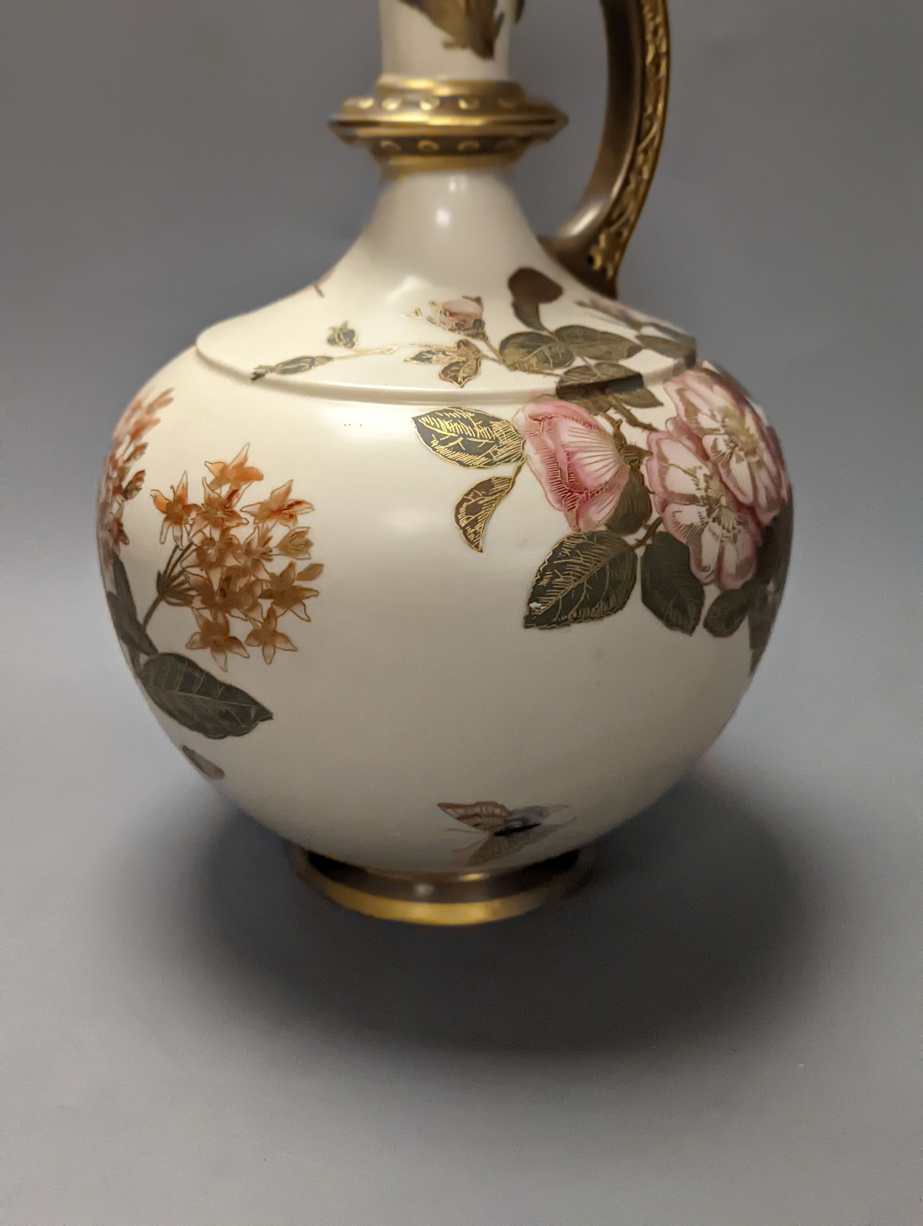 A Royal Worcester blush Ivory gilded floral ewer and a similar two handled vase 39cm